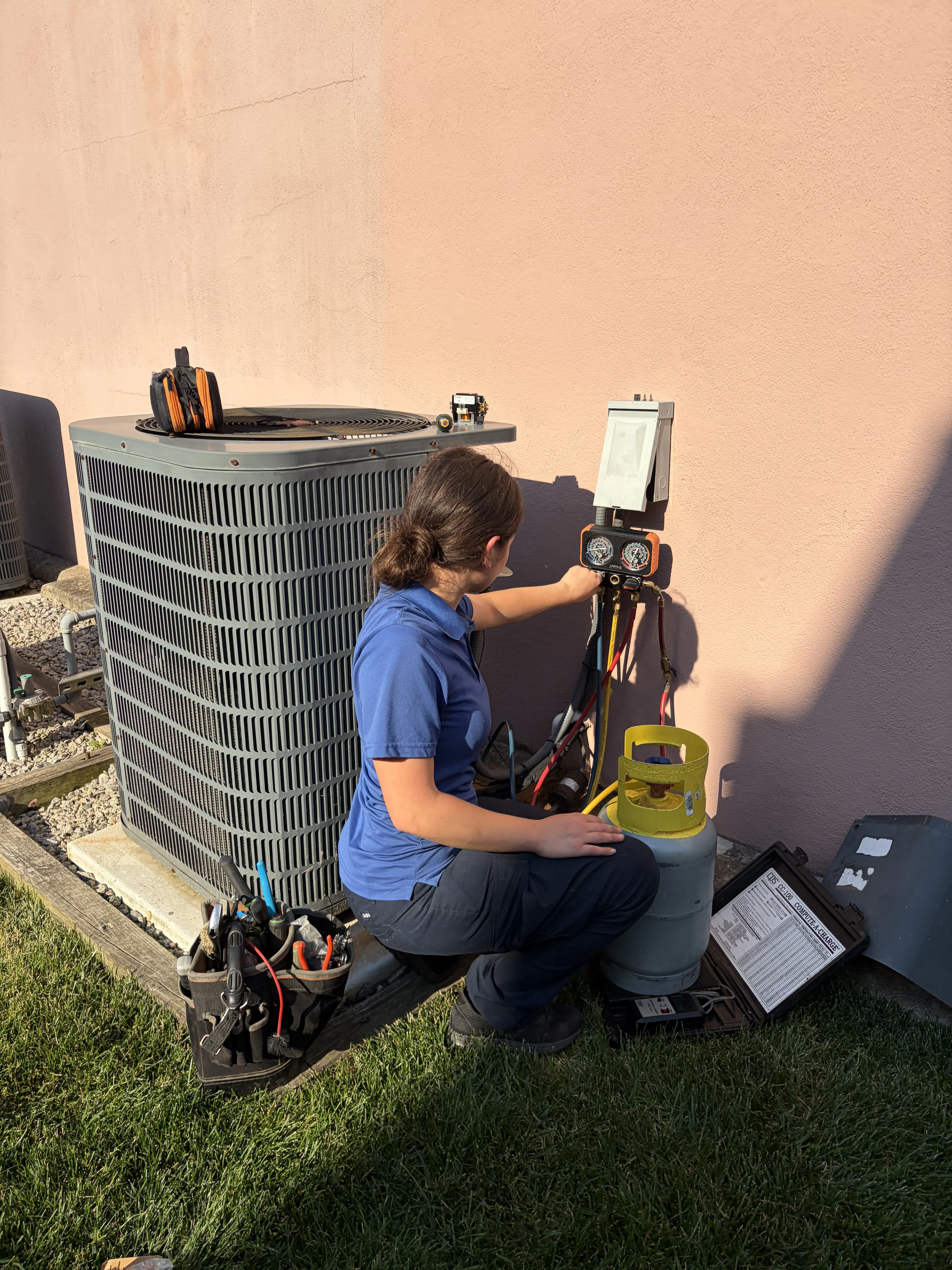 Danielle next to outdoor unit
