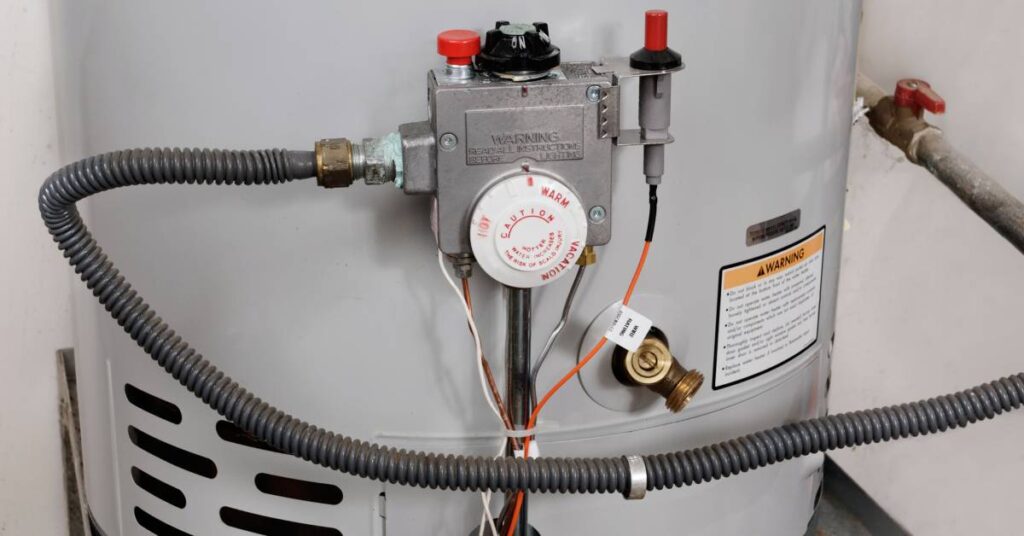 A large neutral-colored water heater, with a focus on the system's water temperature controls and pipes.