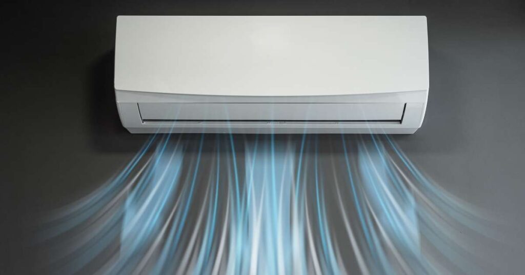 A white in-home air conditioner with an abstract stream of cool white and blue air coming into the room.